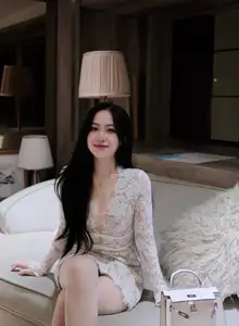 Captivating Beauty: Young Woman in Elegant Lace Dress Shines in Luxurious Restaurant Setting.-1