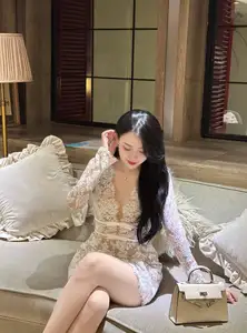 Captivating Beauty: Young Woman in Elegant Lace Dress Shines in Luxurious Restaurant Setting.-10