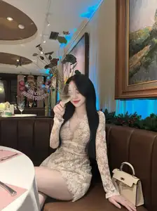 Captivating Beauty: Young Woman in Elegant Lace Dress Shines in Luxurious Restaurant Setting.-7