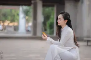 Graceful Vietnamese Girl in White Ao Dai, Radiant Smile at Ancient Site 1000026917-21