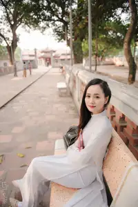 Graceful Vietnamese Girl in White Ao Dai, Radiant Smile at Ancient Site 1000026917-12