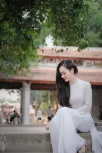 Graceful Vietnamese Girl in White Ao Dai, Radiant Smile at Ancient Site 1000026917-18