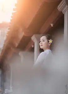 Graceful Vietnamese Girl in White Ao Dai, Radiant Smile at Ancient Site 1000026917-5