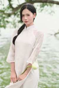 VGU No.16: Discover the Gentle Charm of White Ao Dai and Lotus – Captivating Vietnamese Beauty-1