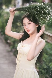 Serene Natural Beauty: Gentle Girl in Cream Dress Amidst Lush Garden-8