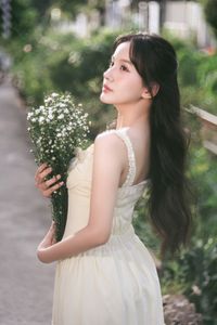 Serene Natural Beauty: Gentle Girl in Cream Dress Amidst Lush Garden-15