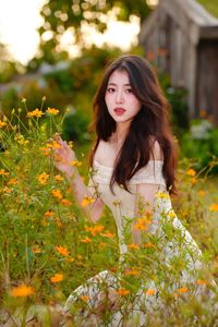 XVG No.2: Serene Beauty A Vietnamese Girl Amidst a Vibrant Flower Garden-11