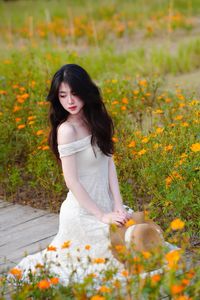 XVG No.2: Serene Beauty A Vietnamese Girl Amidst a Vibrant Flower Garden-7