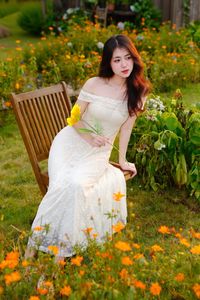 XVG No.2: Serene Beauty A Vietnamese Girl Amidst a Vibrant Flower Garden-2