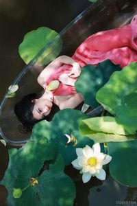 Elegant Vietnamese Girl in Pink Ao Yem by Lotus Pond, Capturing Traditional Beauty and Serenity-8