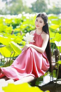 Elegant Vietnamese Girl in Pink Ao Yem by Lotus Pond, Capturing Traditional Beauty and Serenity-10