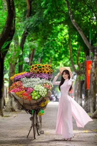 XVG No.23: Enchanting Vietnamese Ao Dai Beauty with Vibrant Flower Bicycle on a Green Street-6