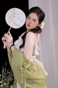 Elegant Vietnamese Girl in White, Embracing Tea Ceremony and Lotus Flowers – Traditional Beauty.-6