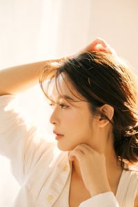 Captivating Female Portrait Bathed in Radiant Morning Sunlight, Embracing Natural Beauty 1000018680-7