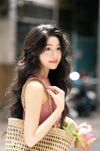 Vietnamese Grace: Elegant Girl in Traditional Flower Market, Discover Vibrant Culture 1000019476-3