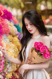 Radiant Vietnamese Girl Amidst a Sea of Vibrant Flowers-3
