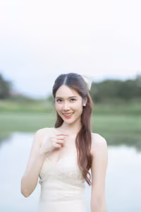 XVG No.19: Radiant Bride: Beautiful Woman in Elegant White Gown with a Joyful Smile in Lush Green Setting.-5