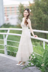 XVG No.19: Radiant Bride: Beautiful Woman in Elegant White Gown with a Joyful Smile in Lush Green Setting.-16