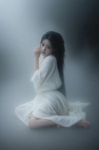 Ethereal Woman in White Dress Amidst Misty Haze Portrait-4
