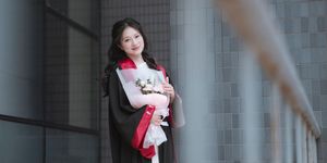 Radiant Student in Graduation Gown Captures Memorable Moment of Success and Joy for a Bright Future.-1