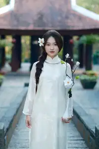 Pure Charm: White-Dressed Girl Winking Playfully with White Flowers 1000024585-0