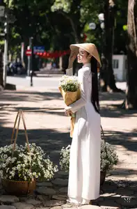 Vietnamese Ao Dai Beauty: Graceful girl with white daisies, an enchanting blend of tradition and charm.-11