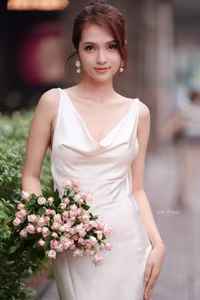 VGU No.11: Elegant Charm: A Woman's Grace in White Gown and Delicate Rose Bouquet-11