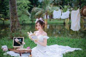 Serene Young Woman in White Dress Reading Book in Lush Nature-6