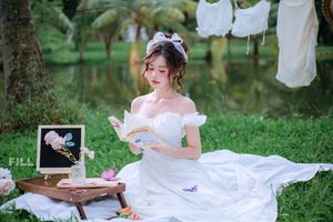 Serene Young Woman in White Dress Reading Book in Lush Nature-4