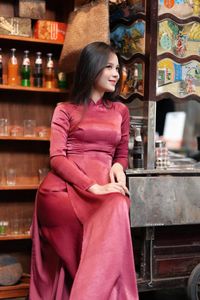 Discover Vietnamese Ao Dai Beauty: Elegant, Graceful Girl in a Cafe Setting-25