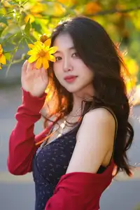 Elegant Asian Girl Portrait with Golden Flowers in Afternoon Sun 1000024552-0