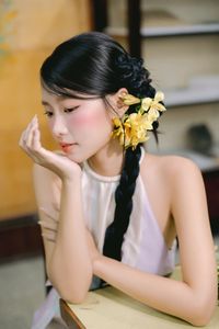 Captivating Asian Beauty: Elegant Young Woman with Braided Hair and Dreamy Gaze - 1000019730-4