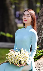 VGU No.113 Elegant Vietnamese Girl in Blue Ao Dai Captures Timeless Beauty Amidst Nature Serenity-0