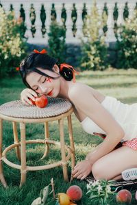 Beautiful Woman Enjoying Fresh Summer Peaches in a Lush Garden Setting, Healthy Lifestyle Inspiration.-10