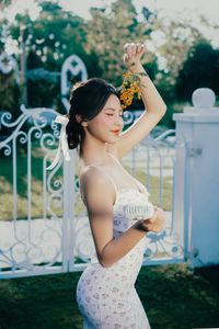Beautiful Woman Enjoying Fresh Summer Peaches in a Lush Garden Setting, Healthy Lifestyle Inspiration.-3