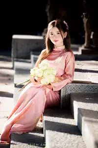 Captivating Serenity: Vietnamese Girl in Pink Ao Dai with Lotus Flowers1730591-12
