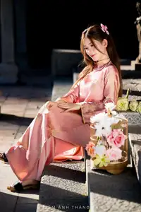 Captivating Serenity: Vietnamese Girl in Pink Ao Dai with Lotus Flowers1730591-6