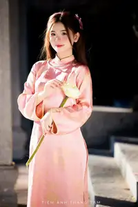 Captivating Serenity: Vietnamese Girl in Pink Ao Dai with Lotus Flowers1730591-7