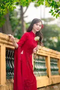 VGU No.188: Captivating Elegance: Vietnamese Beauty in Red Áo Dài with Sacred Lotus Flower.-1