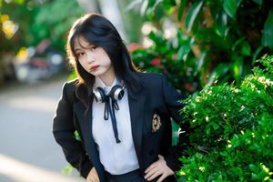 Discover the captivating smile of an Asian girl amidst vibrant nature-1