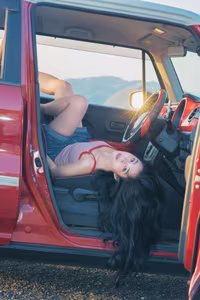 VGU No.128: Summer vibes: Young woman relaxed on a red car, captivating free spirit-7