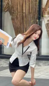 Vibrant Street Style: Young Woman Radiates Energy in Urban Chic Outfit-2