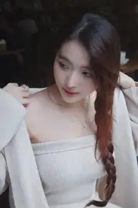 Discover the elegant charm of a gentle woman captured in a serene, thoughtful moment 176403855-1