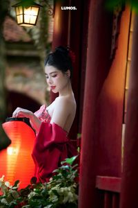 Traditional Vietnamese Beauty: Elegant Woman with Red Lantern, Capturing Asian Charm. 1000018929.jpg-7