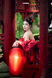 Traditional Vietnamese Beauty: Elegant Woman with Red Lantern, Capturing Asian Charm. 1000018929.jpg-11