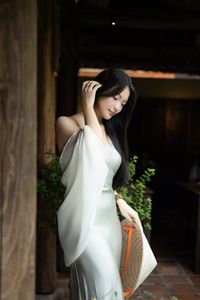 Graceful Vietnamese Girl in Traditional Conical Hat-1