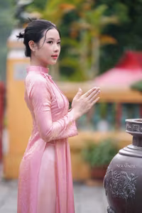 VGU No.136: The Graceful Pink Ao Dai: Vietnamese Beauty Embracing Tradition and Serenity-12