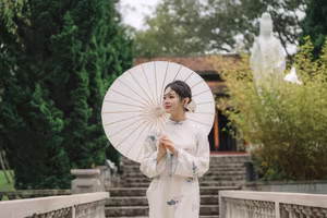 XVG No.29: Graceful Ao Dai - Unveiling the Serene Beauty of a Vietnamese Woman with Golden Blooms.-4