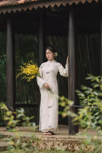 XVG No.29: Graceful Ao Dai - Unveiling the Serene Beauty of a Vietnamese Woman with Golden Blooms.-7