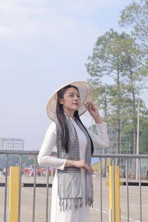 Elegant Vietnamese Woman in White Ao Dai Embracing Spirit of Independence-8